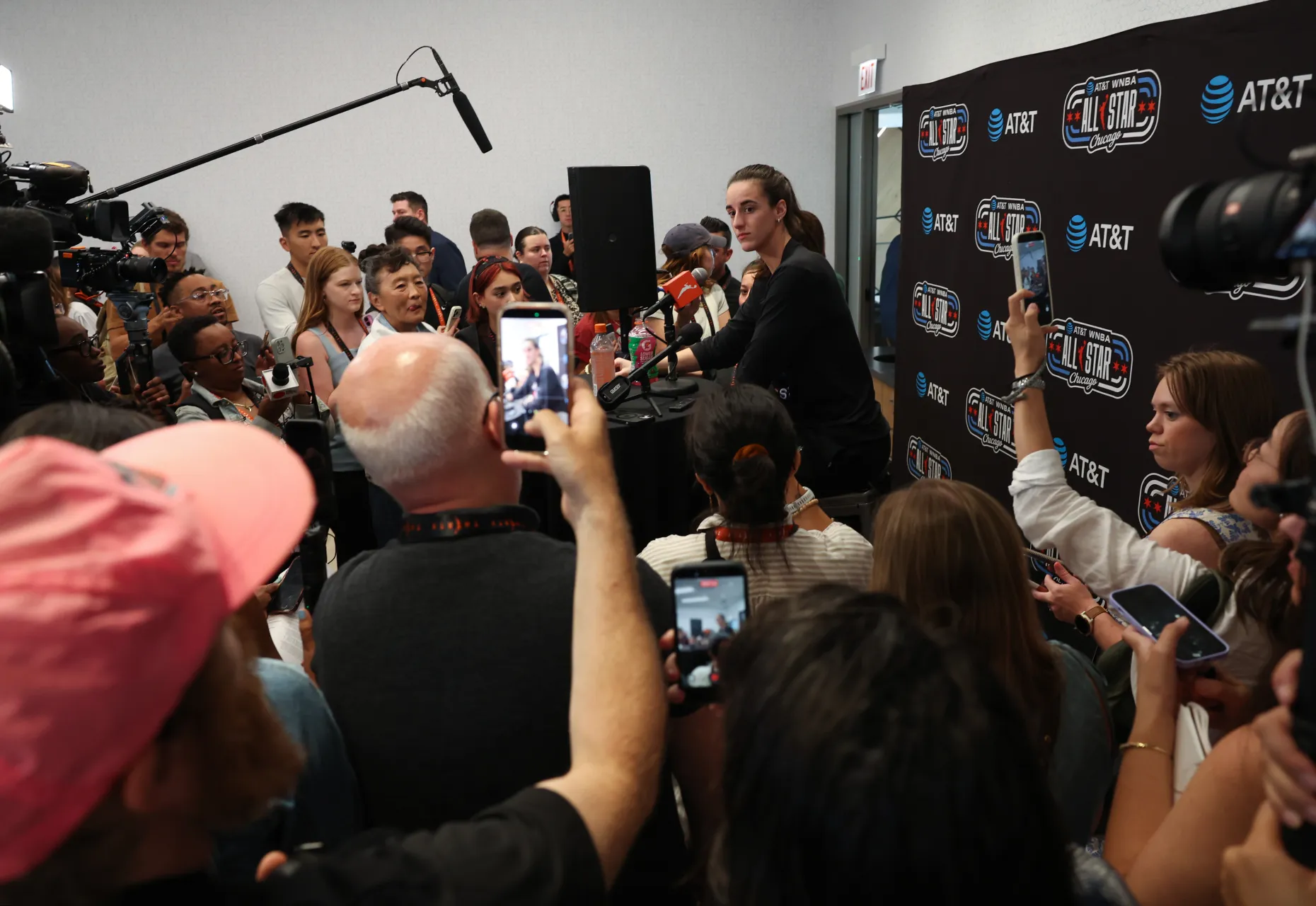 Indiana Fever guard Caitlin Clark, center right, answers reporters' questions before an All-Star Game practice at Home Court on the Obama Presidential Center campus on July 24, 2026.